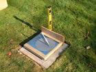 the sundial is fixed to the top of the plinth, which is placed directly on the paving stone, and the level is again checked 