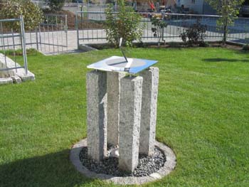 Stainless sundial in a garden in Germany