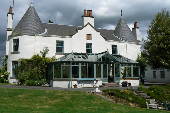 A turreted house in Scotland with its sundial