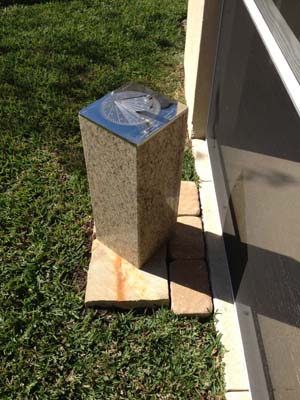  Stainless sundial memorial in a garden