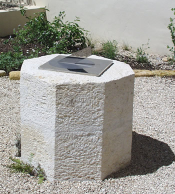 stainless sundial on octagonal plinth